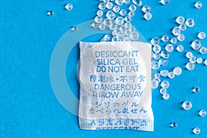Pouch with Silica gel unfolded on blue background