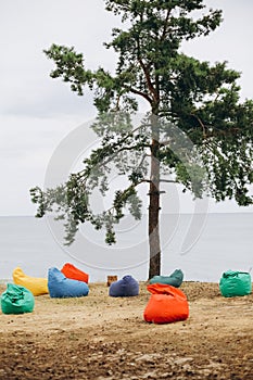 Poufs multi colored seashore one tree send
