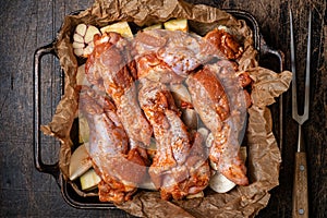 Poultry baked with vegetables. The turkey wing is ready to roast.