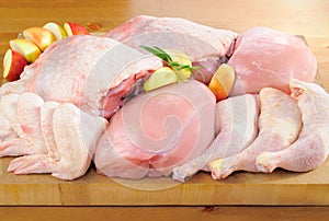 Poultry meat arrangement on kitchen board photo