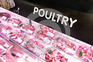 Poultry signage at the meat produce section of supermarket with defocused background