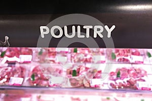 Poultry signage at the meat produce section of supermarket with defocused background