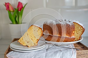 Pound cake or angel food cake sliced on a cake stand