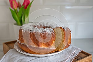 Pound cake or angel food cake sliced on a cake stand