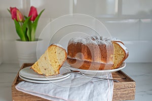 Pound cake or angel food cake sliced on a cake stand