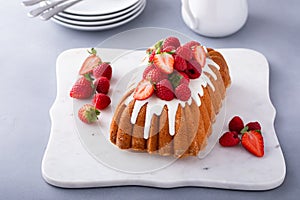 Pound cake with sugar glaze and berries on top