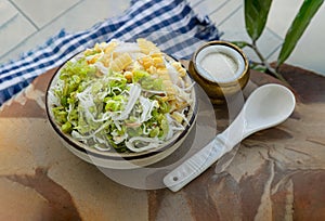 Pounded unripe rice Flakes Cereal Khao Mao and Steamed Sweet Corn mixed with Grated young Coconut flesh