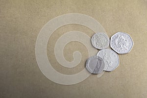 Pounds Sterling coins on the wooden background