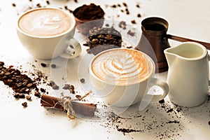 Pour latte art in a coffee cup