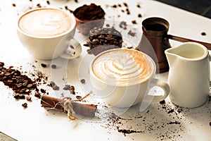 Pour latte art in a coffee cup