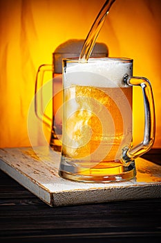 Pour Light Beer into Mugs