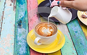 Pour milk to Coffee cup photo