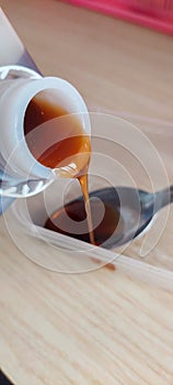 Pour raw honey to get healthy drink