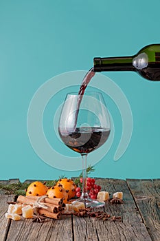 Pour the red wine into a glass