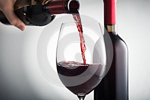 Pour red wine into glass