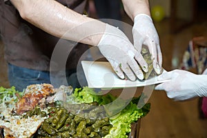 Pour the stuffing into a plate. Barbecue is prepared of lamb or sheep meat and processed by slasher. pilaf . tin stuff .