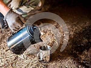 Pour water into a beaker with an old coffee pot