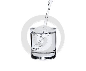Pour water in glass isolated on white background with clipping path