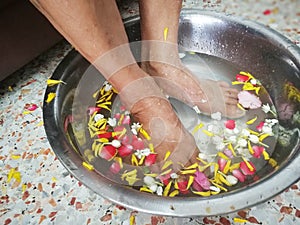 Pour water on the hands of revered elders and ask for blessing