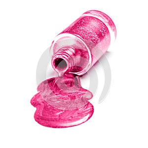 Poured pink nail polish isolated on white background.