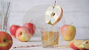 Pouring the apple juice into a glass.