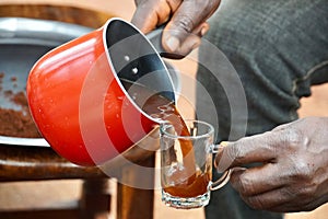 Pouring Arabica Coffee into a Mug
