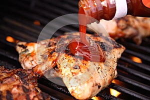 Pouring Barbeques Sauce on Chi photo