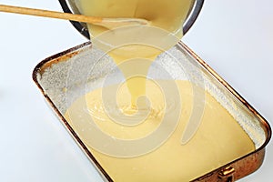 Pouring batter into baking pan