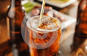 Pouring beer with chicken wings