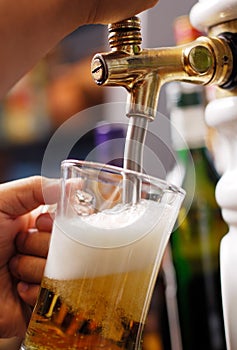 Pouring beer into glass