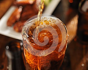 Pouring beer into glass