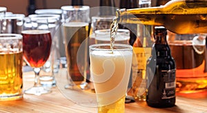 Pouring beer in a glass of beer on a pub background