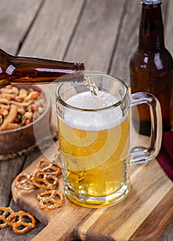 Pouring Beer into a Glass Mug