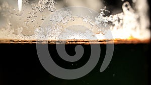 Pouring beer. Macro shot.