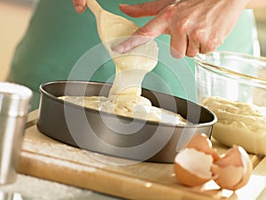Pouring Cake Mixture Into Baking Tin