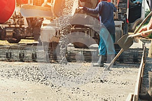 pouring cement during upgrade street at construction