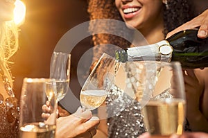 Pouring champagne at party