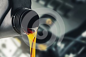 Pouring changing car engine oil photo