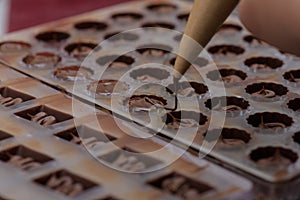 Pouring chocolate into molds