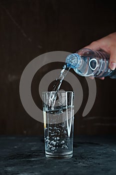 pouring water into a glass