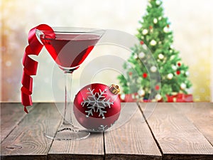 Glass with martini cocktail on festive background