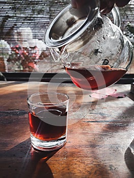 Pouring coffee into a glass