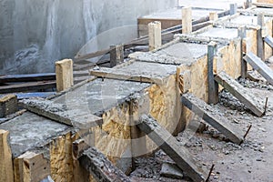 Pouring the concrete base of the house. Formwork Home construction. Technology pouring concrete. Restoration of formwork of a