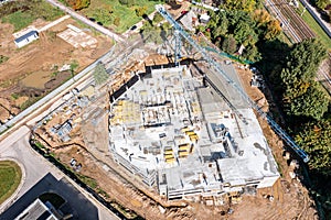 Pouring concrete on the floors of new multi-story building under construction. aerial photo