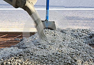 Pouring concrete view of shovel and steel photo