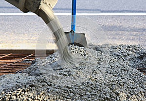 Pouring concrete view of shovel and steel