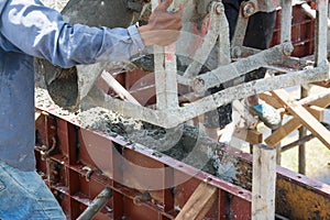 Pouring concrete works at construction site