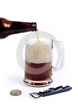 Pouring dark bock beer into the glass