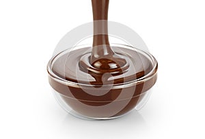 Pouring dark melted chocolate isolated on white background. photo
