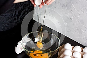 Pouring eggs into a glass cup